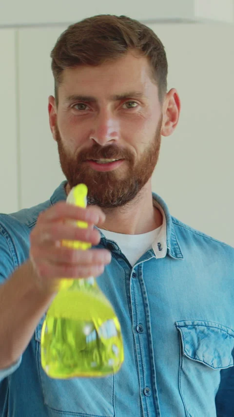 Vertical Video Portrait of man who is ready for housework. Stock Footage 337994111