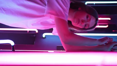 Vertical video - portrait in the neo. Model in a nightclub Stock Footage 152565573