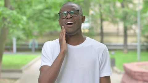 Vertical Video, Portrait, Sick Young African Man Toothache Outdoors Stock-Footage 310833017
