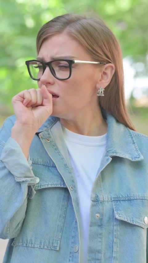 Vertical Video, Portrait, Sick Young Woman Coughing Outdoors Stock Footage 318013368