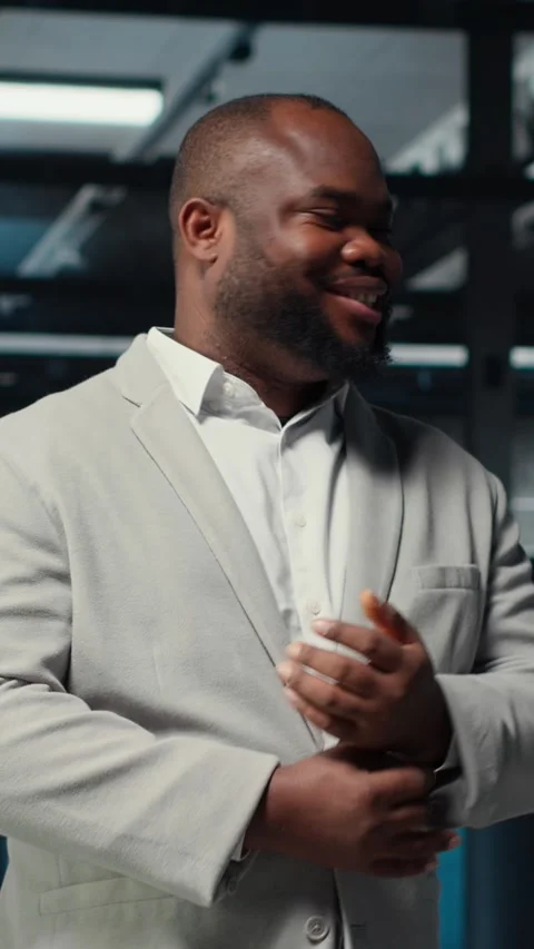 Vertical video Portrait of smiling admin doing yearly checkup on data center Stock Footage 311546214