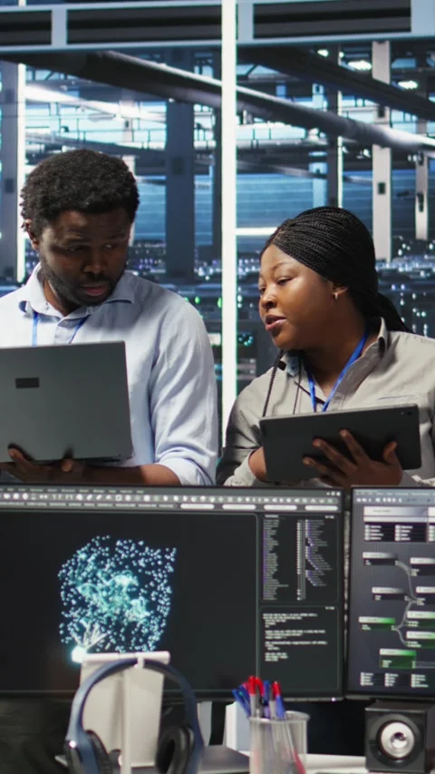 Vertical video Portrait of smiling data center specialists collaborating in Stock Footage 308752262