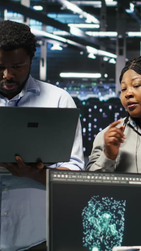 Vertical video Portrait of smiling data center specialists collaborating in Stock Footage 308752386