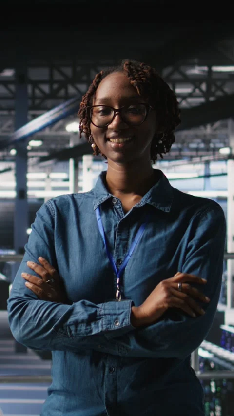 Vertical video Portrait of smiling data center admin next to coworkers Stock Footage 310771393