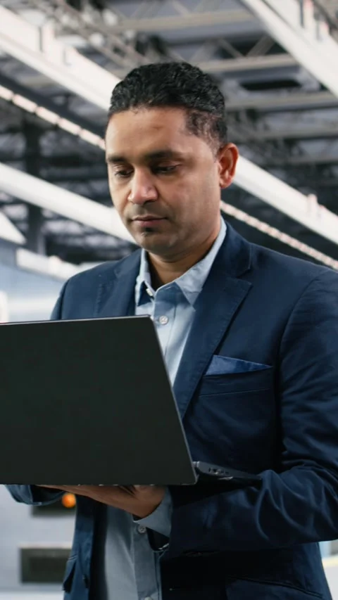 Vertical video Portrait of smiling microchip factory manager using laptop to Stock Footage 333615221
