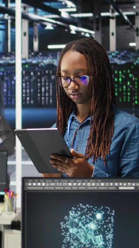 Vertical video Portrait of smiling server room engineer using device to Stock Footage 307969400