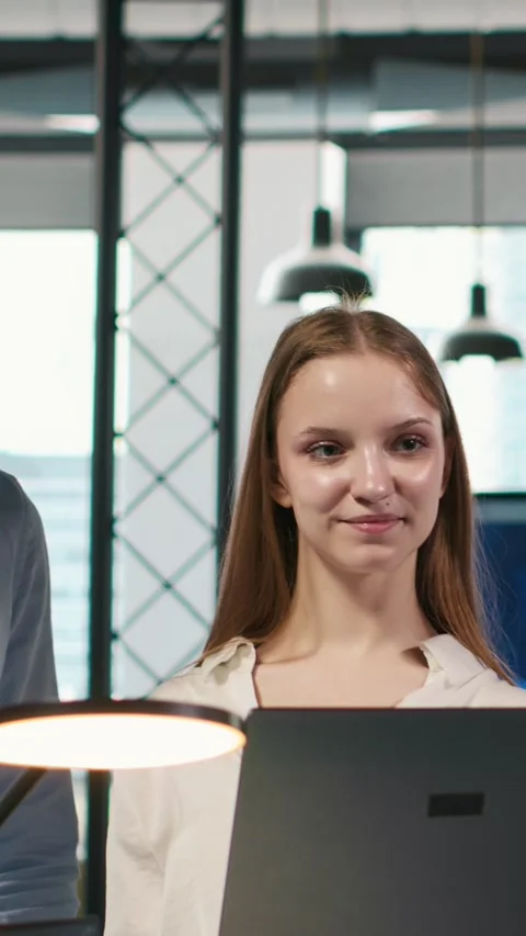 Vertical video Portrait of smiling teamworking programmers utilizing AI to Stock Footage 312767973