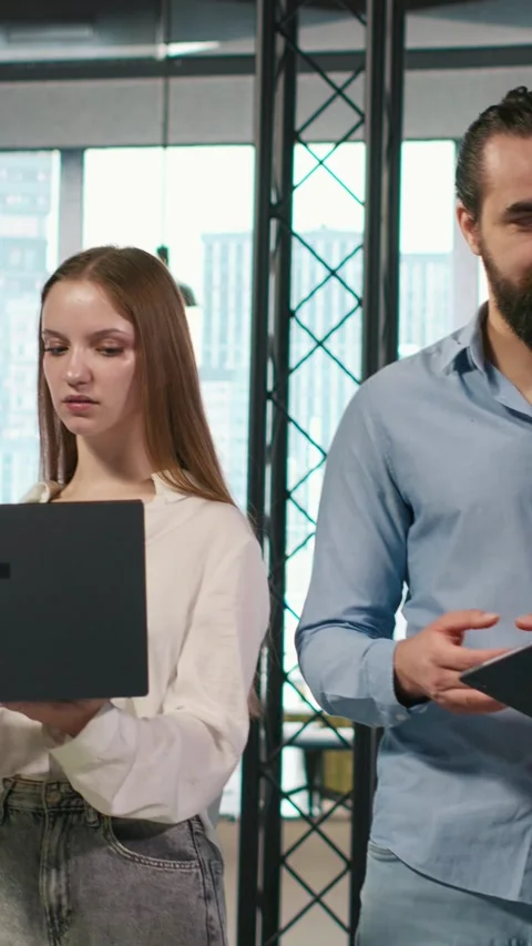 Vertical video Portrait of teamworking programmers in office developing apps Stock Footage 312708097