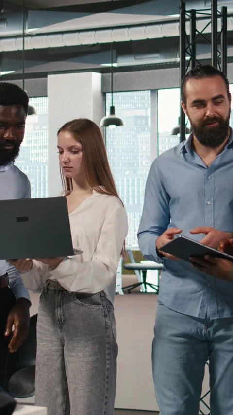 Vertical video Portrait of teamworking programmers in office developing apps Stock Footage 312768015