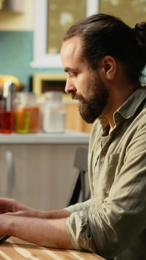 Vertical Video Portrait of video editor working remotely editing multimedia Stock Footage 330439204