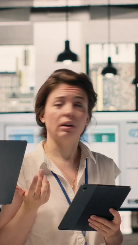 Vertical Video Portrait of work team analyzing data analysis results and KPI Stock Footage 329316527