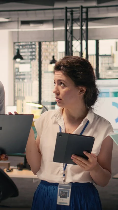 Vertical Video Portrait of work team analyzing data analysis results and KPI Stock Footage 329316934