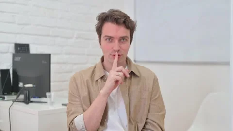 Vertical Video, Portrait, Young Creative Man Showing Silence Gesture Stock Footage 312914545