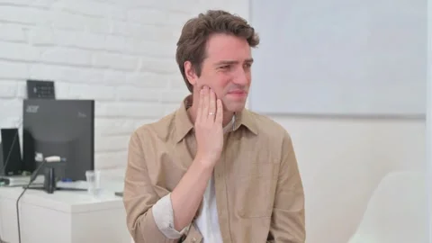 Vertical Video, Portrait, Young Creative Man with Toothache Stock Footage 312914589