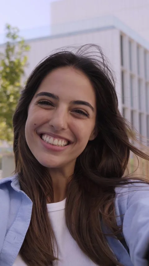 Vertical video portrait Young smiling woman Taking selfie video at university Stock Footage 221656879