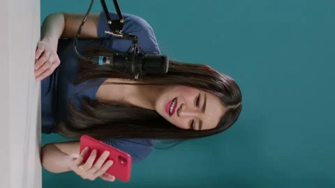 Vertical video: POV of content creator reading comments on camera Stock Footage 177211578