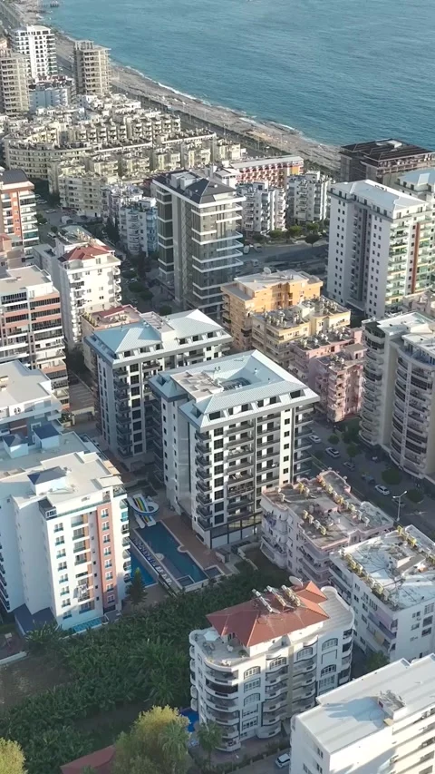 Vertical Video: Premium Complex with Sparkling Pools, Stylish Facade, and Stock Footage 297755570