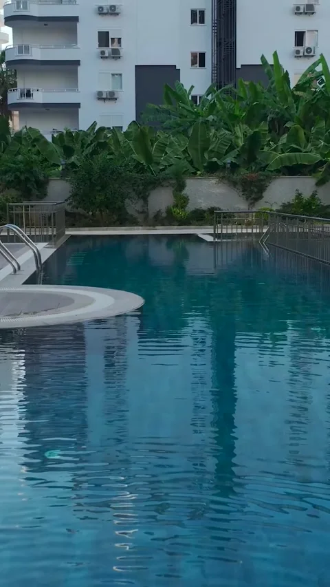 Vertical Video: Premium Complex with Stylish Pools, Fun Slides, and a Stunning Stock Footage 297756786