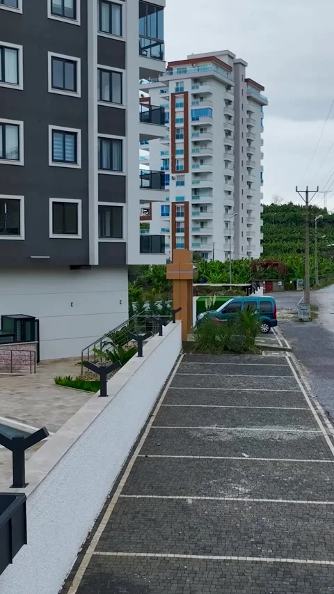Vertical Video: Premium residential complexes with swimming pools, manicured Stock Footage 297636535