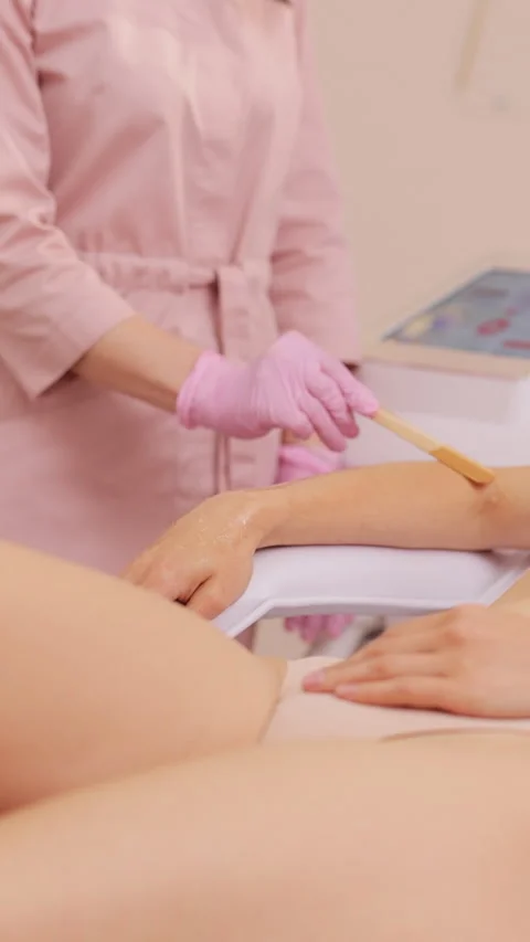 Vertical Video of Preparation of clients hand before laser hair removal Stock Footage 306318988