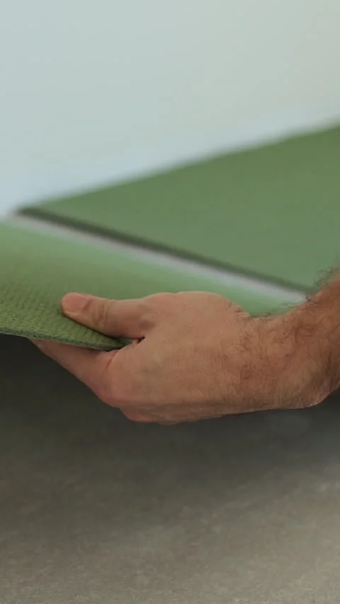 Vertical video Preparatory work before laying a laminate board. Stock Footage 339060174