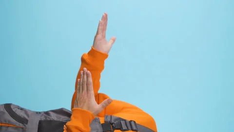 Vertical video of presentation gestures on blue studio backround Stock Footage 231481445