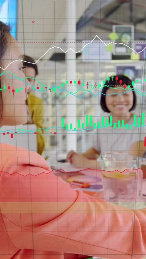 Vertical video: Presenter pointing at swatches, creating charts over table for Stock Footage 333577723
