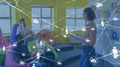 Vertical video: Presenter tapping tablet, animating network of icons linking to Stock Footage 333539741