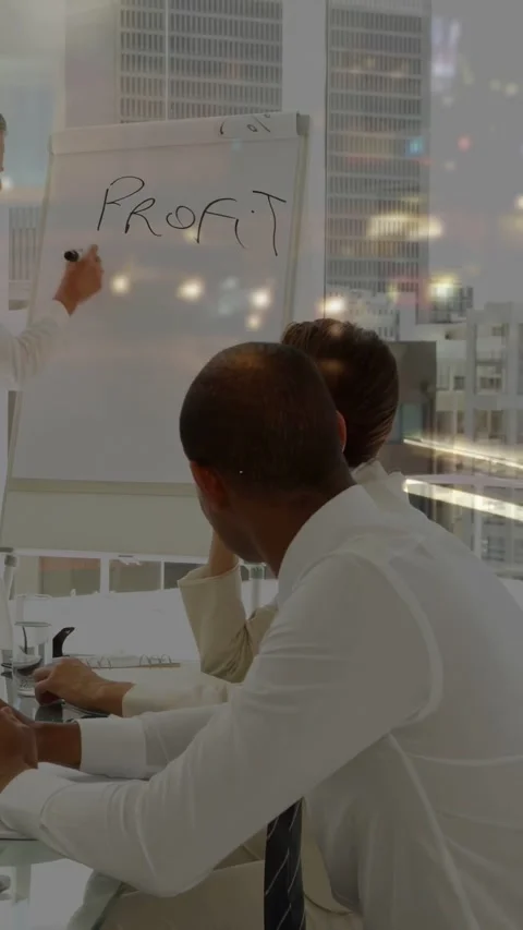 Vertical video: Presenter writing chart in business meeting, team watching Stock Footage 333020665
