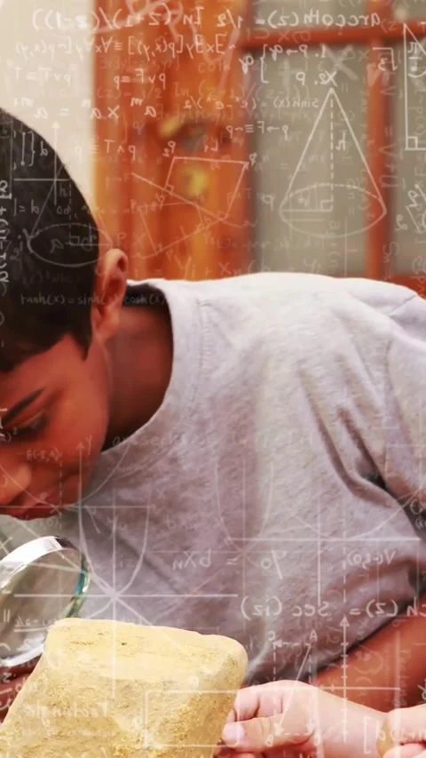 Vertical video: Presenting magnifier, boy in gray shirt probing block with math Stock Footage 330189499