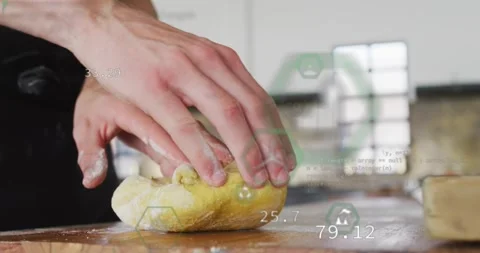 Vertical video: Pressing right hand man in dark apron shaping dough to bake at Stock Footage 331503236