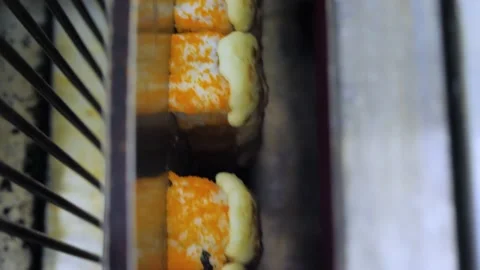 Vertical video of A process of preparation and baking of hot sushi in bake Stock Footage 237520481