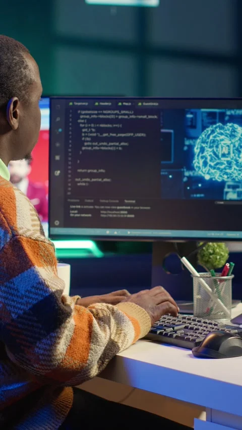 Vertical Video Professional male developer manages neural network at desk Stock Footage 319517802