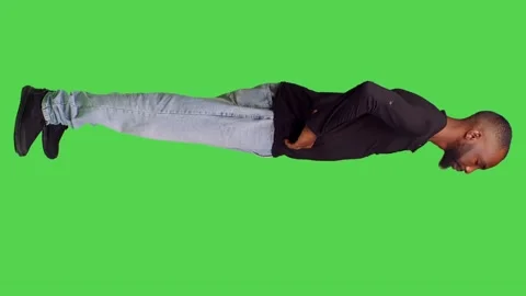 Vertical video: Profile of friendly male model waving at someone on camera Stock Footage 237644059