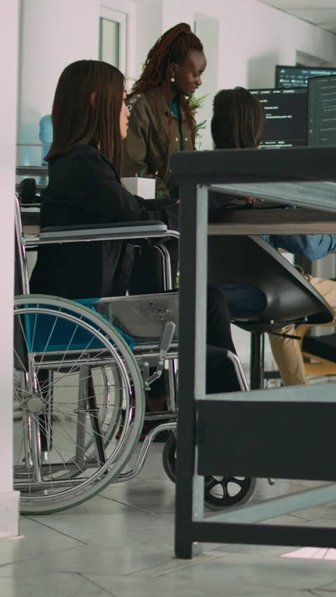 Vertical video: Programer with chronic disability typing source code on computer Stock Footage 218575412