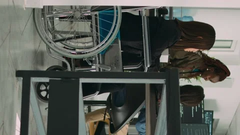 Vertical video: Programer with chronic disability typing source code on computer Stock Footage 219701947