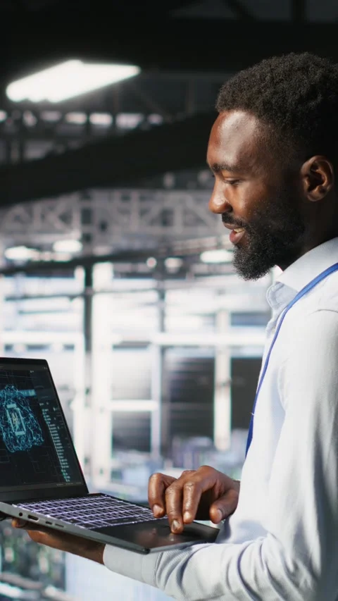 Vertical video Programmer and colleague in data center reviewing AI LLM Stock-Footage 310780075