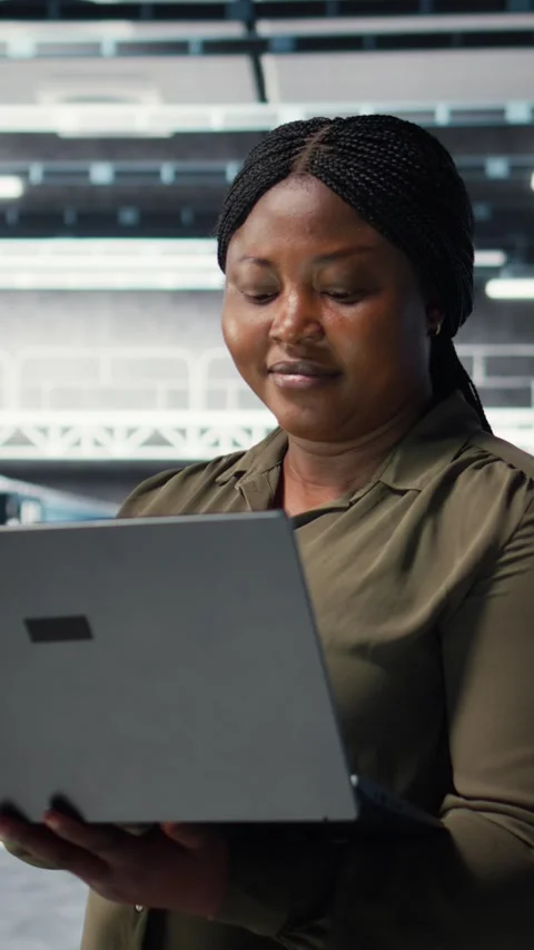 Vertical video Programmer in data center using laptop to upgrade systems Stock Footage 317054257