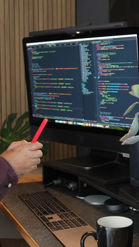 Vertical Video: Programmer Interacting with Social Media on Desktop Stock-Footage 314711437