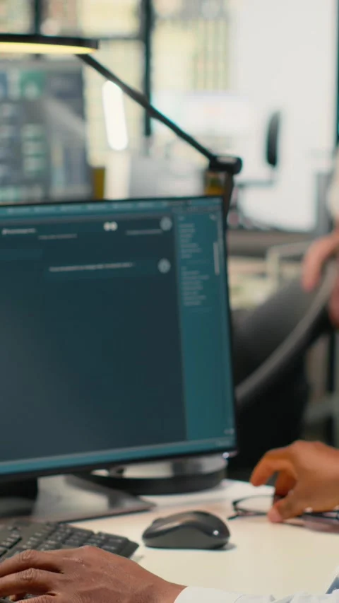 Vertical video Programmer in office using AI LLM chatbot to get help Stock Footage 323142325