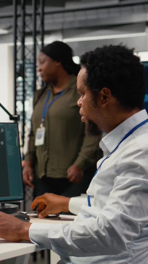 Vertical video Programmer in office using AI LLM chatbot to get help Stock Footage 323142568