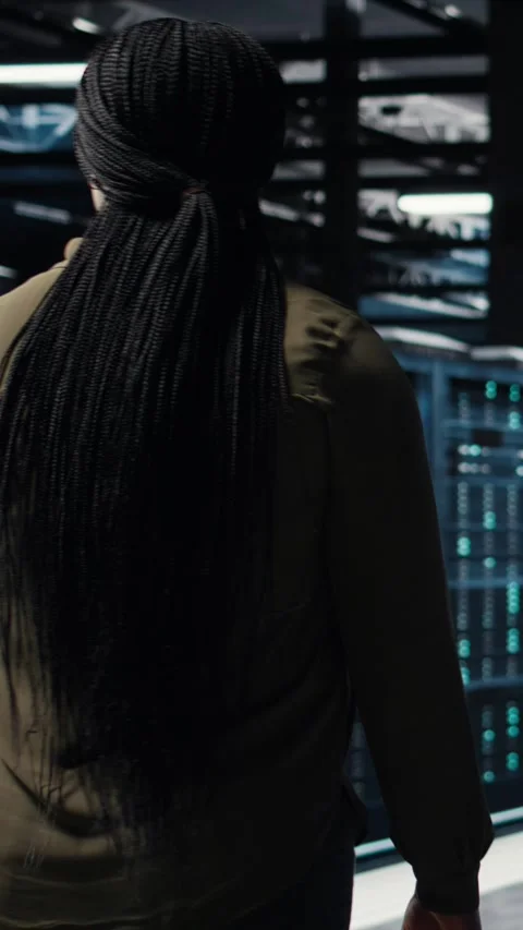 Vertical video Programmer overseeing server farm, ensuring compliance with Stock-Footage 317054166