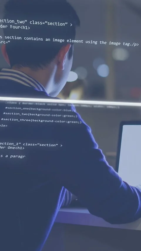 Vertical video: Programmer typing at desk activating neon cube with code Stock-Footage 334792639