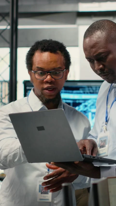 Vertical video Programmers in office doing software development, brainstorming Stock Footage 323142254