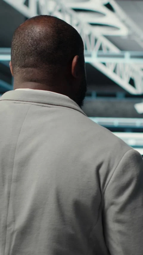 Vertical video Programmers walking in data center coding, doing optimizations Stock Footage 311339410