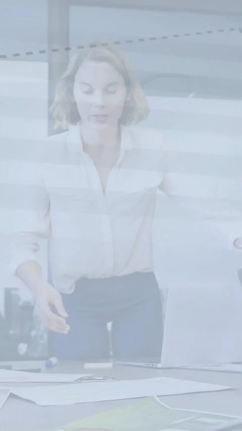 Vertical video: Project manager sorting charts and papers on table, preparing Stock Footage 337540791