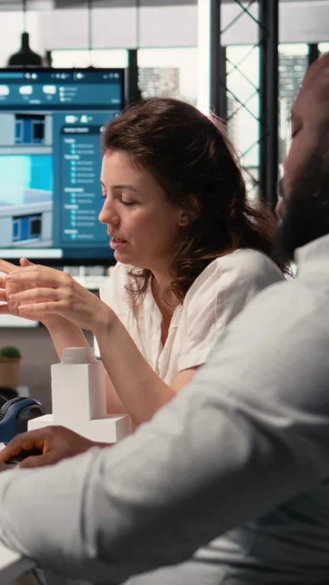 Vertical Video Property development diverse team manages urban projects with Stock Footage 316341235