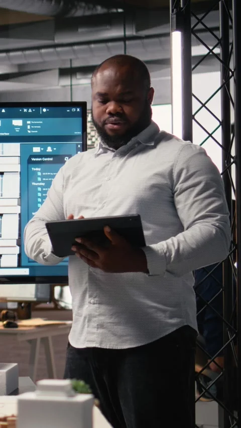 Vertical Video Property investment developer checks blueprints and layout plans Stock Footage 316340687