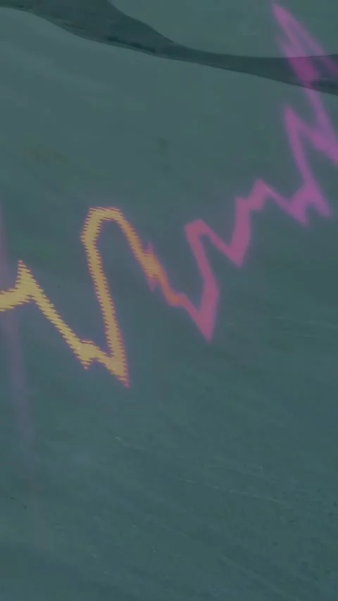 Vertical video: On pullback coastal wave pulsing while gold spike rising, 50 Stock Footage 332277977