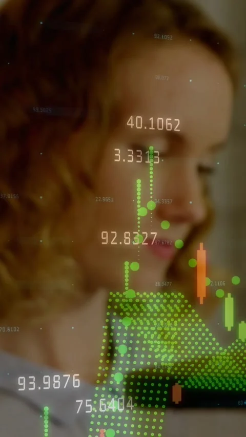 Vertical video: Pullback showing finance candles over hopper, woman monitoring Stock Footage 331721044